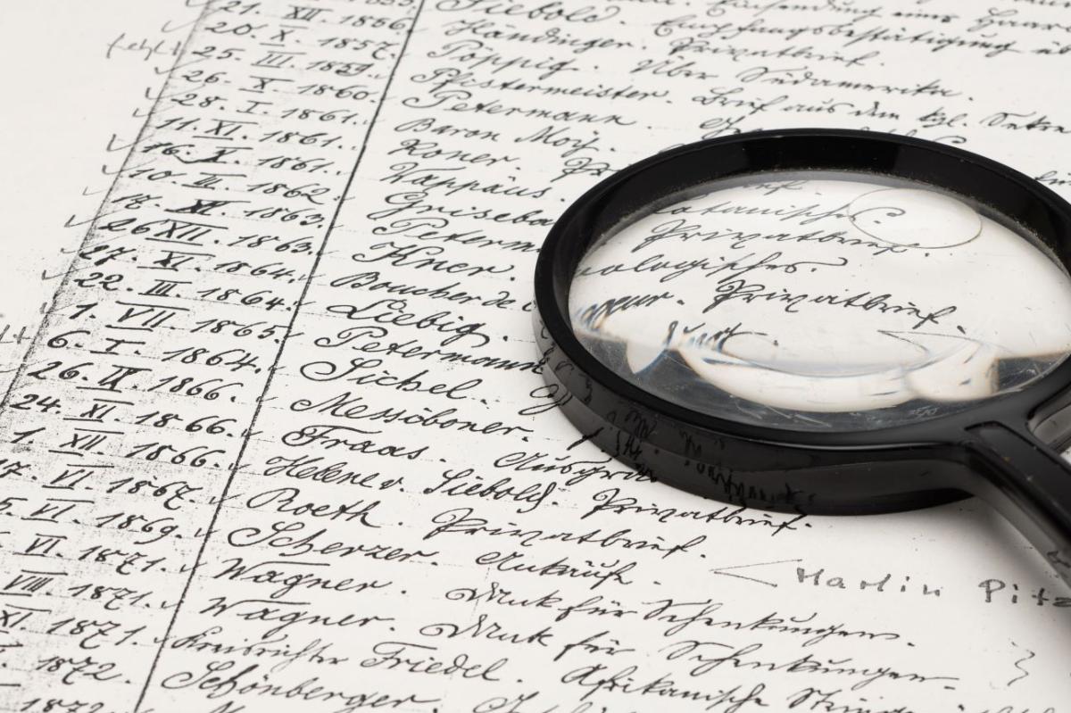 Symbolic image inventory list with magnifying glass