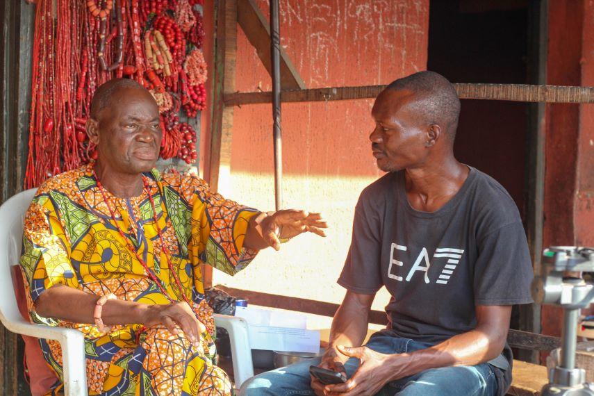 Rasheed Hassan interviewing Chief Nosa Omorodion of Benin during his fieldwork